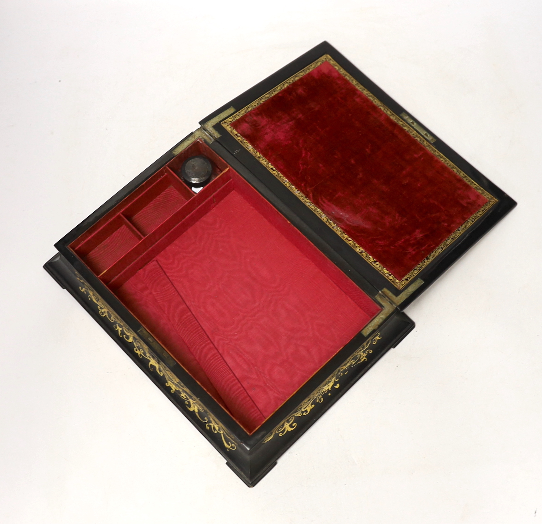 A Victorian stamped Jennens and Bettridge papier mache writing box, hand painted with a continental landscape with fitted watered silk interior, 27cm wide